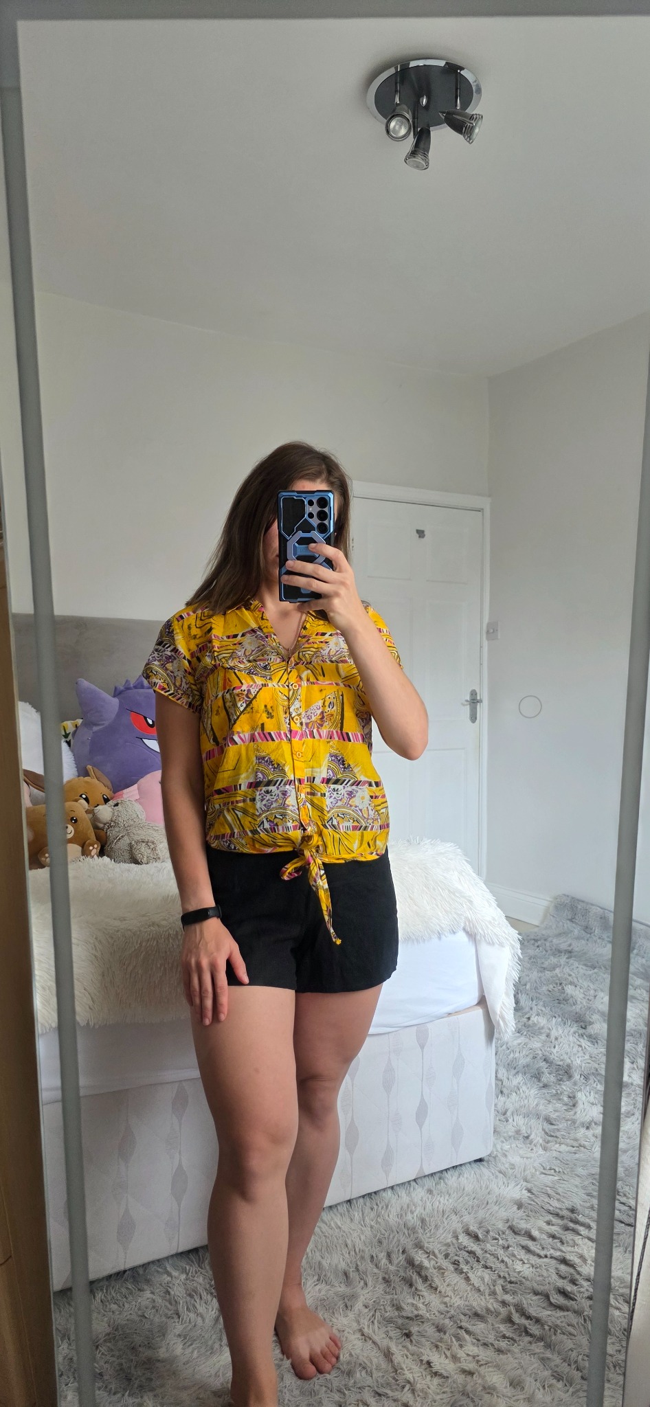 Yellow patterned Brave Soul tie-front blouse styled with black shorts