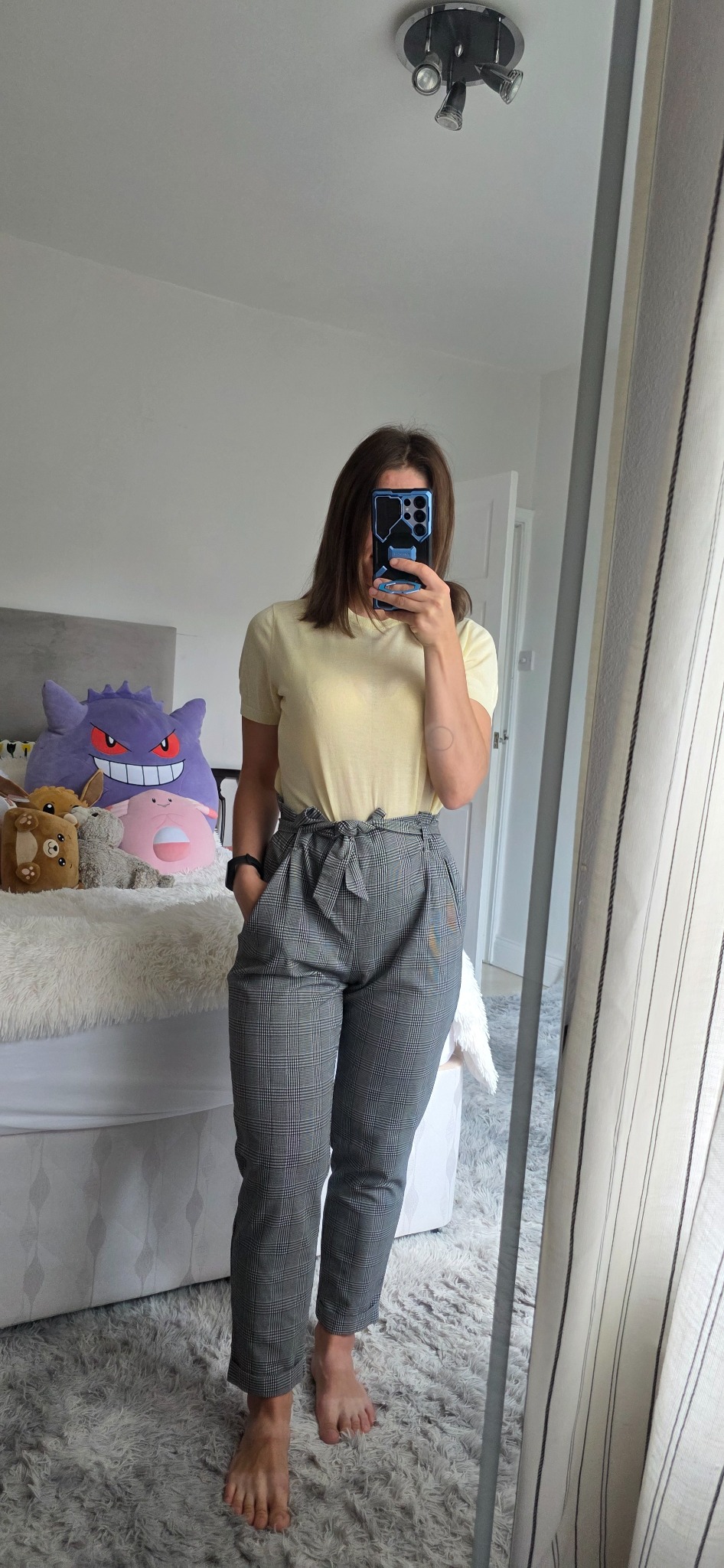 Grey plaid Zara paperbag trousers styled with a pale yellow top
