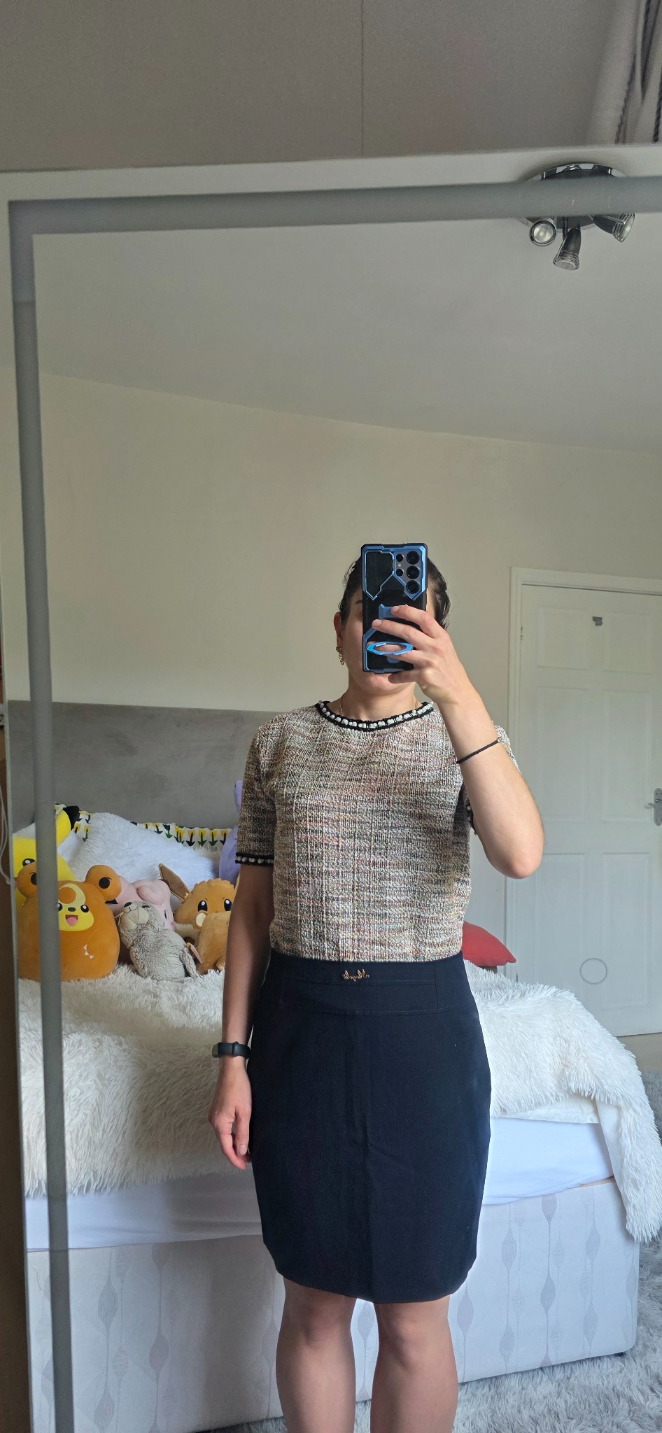 Zara tweed top with a pearl-beaded collar styled with a black skirt